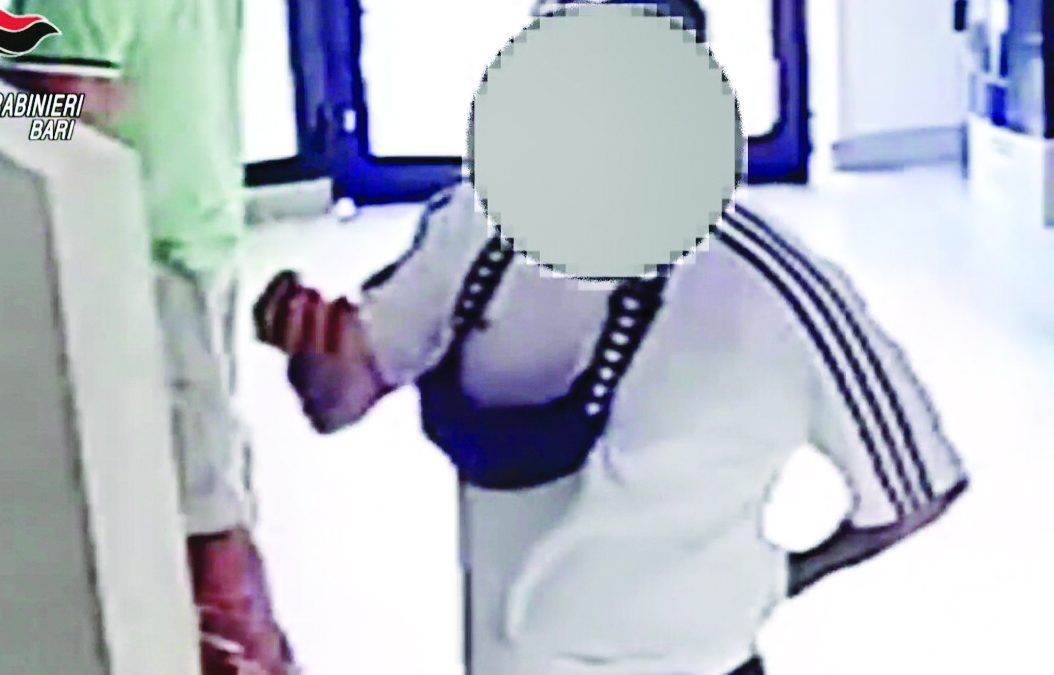 Uno degli arrestati ripreso all’interno dell’agenzia di scommesse