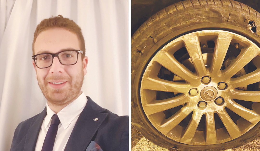 Il consigliere Antonio Loconte e accanto lo pneumatico dell’auto colpito più volte