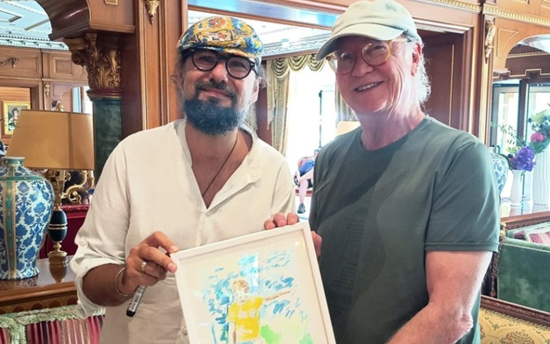 Il pittore Mauro Russo con Paulo Roberto Falcao